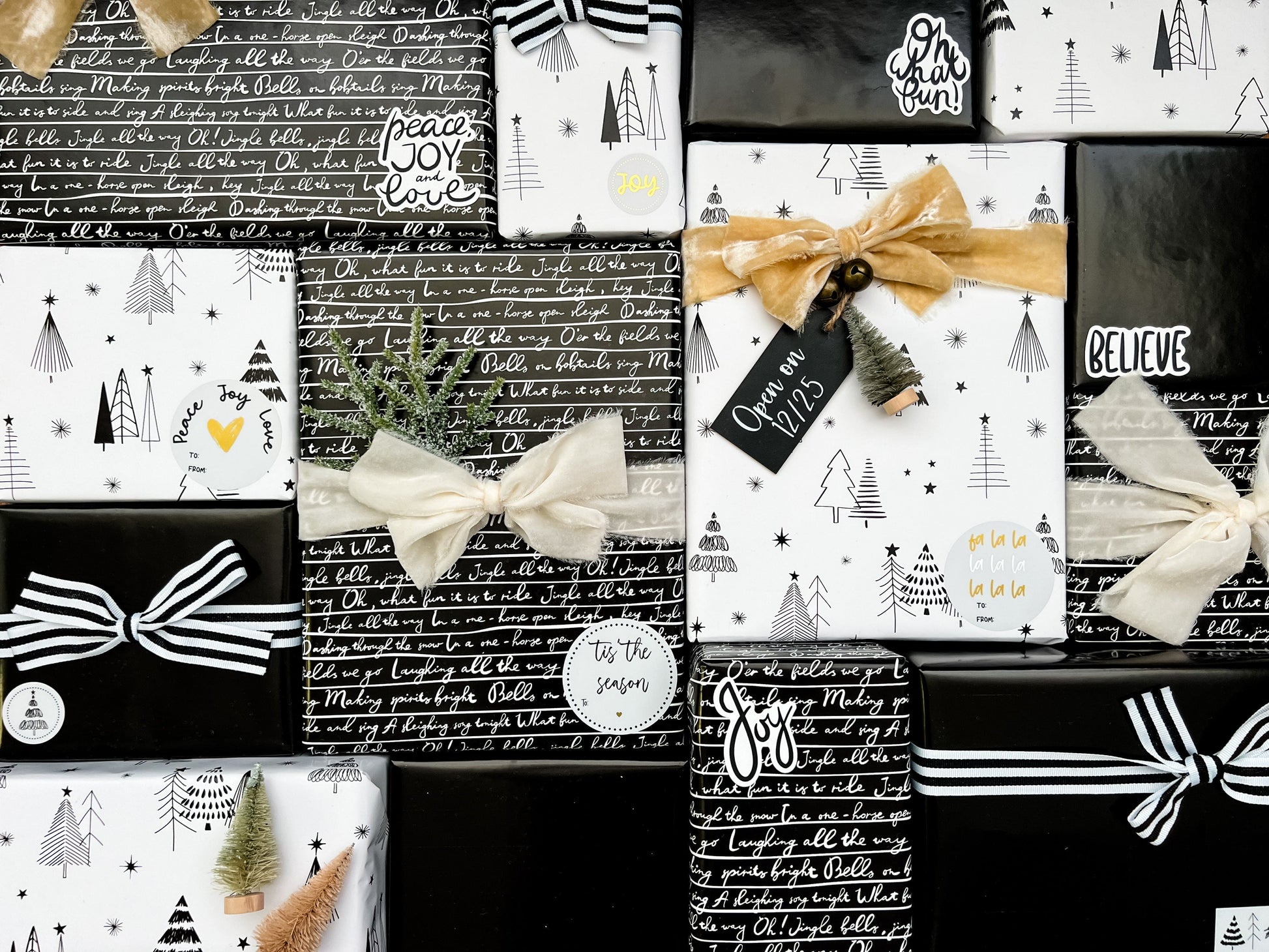 Collection of Christmas-themed gift boxes with bows and text on a black background