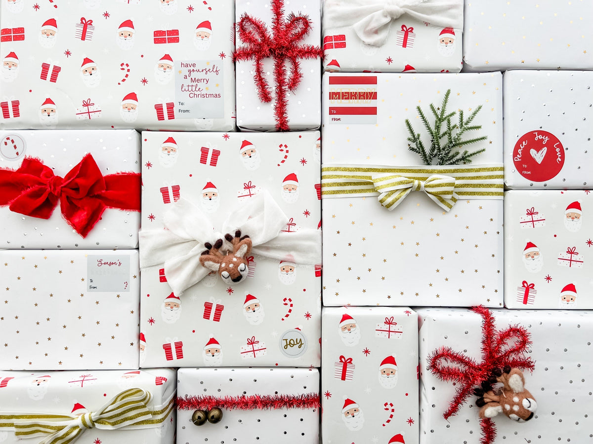 Collection of Christmas-themed gift boxes with various decorative elements on a white background.