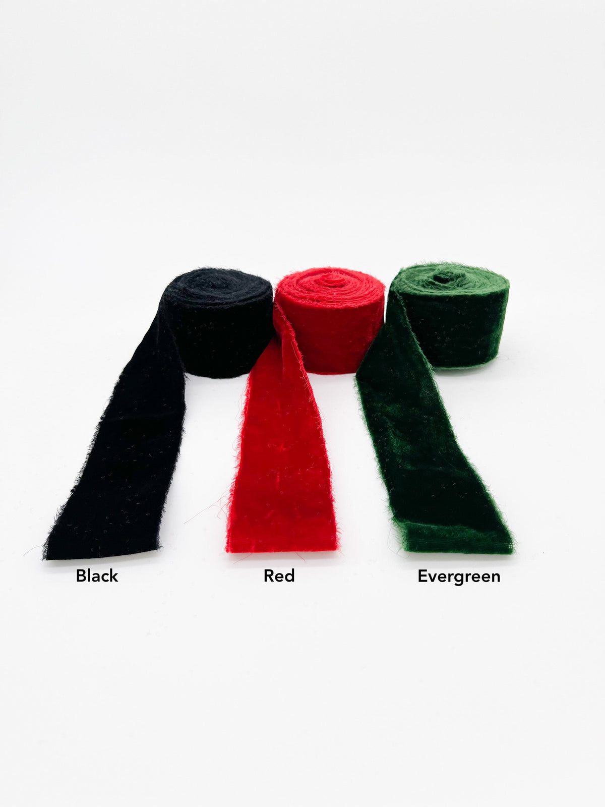 3 colors of velvet, black, red and evergreen