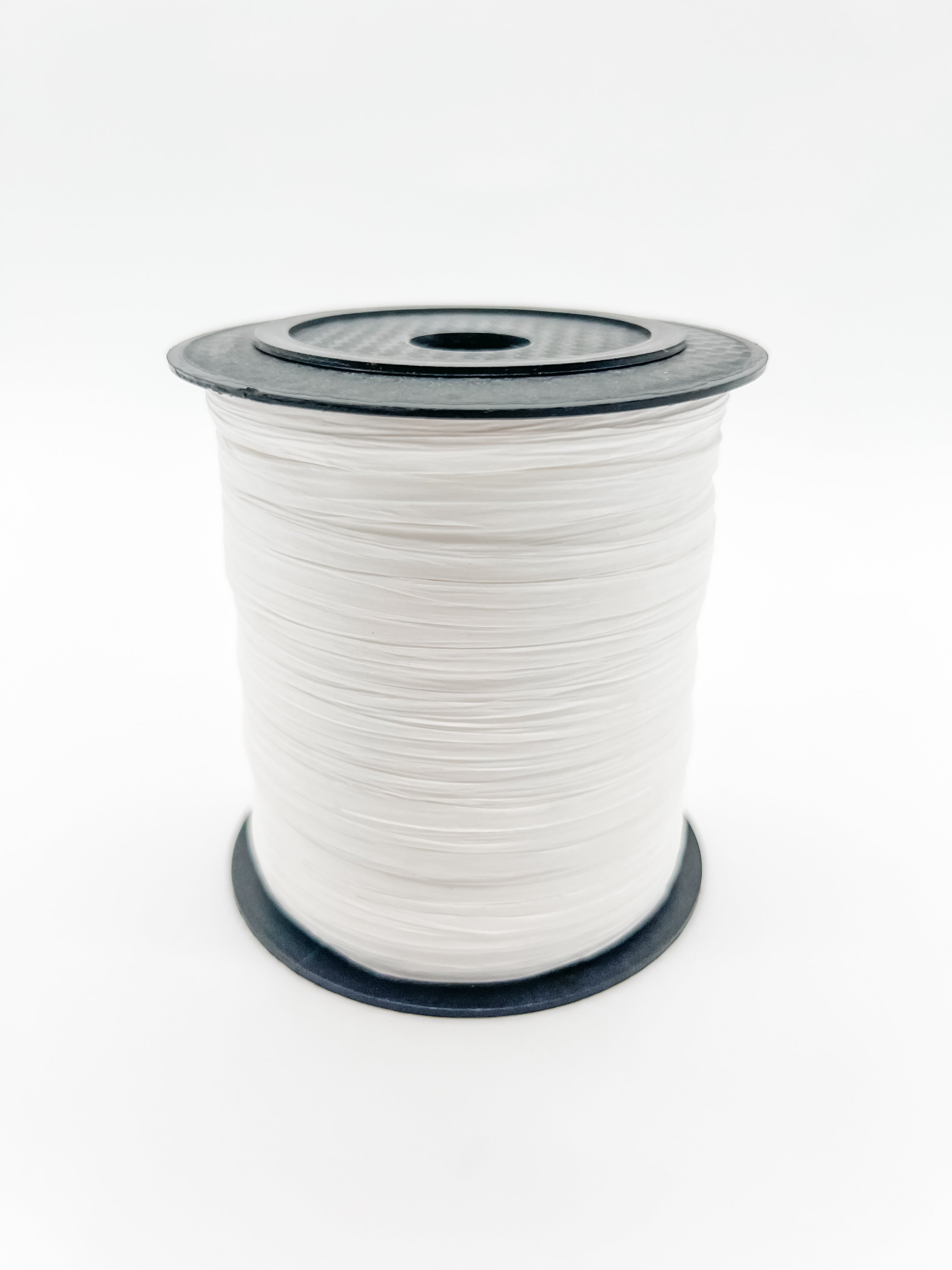 A spool of white paper raffia with a black plastic top and base, photographed on a clean white background.