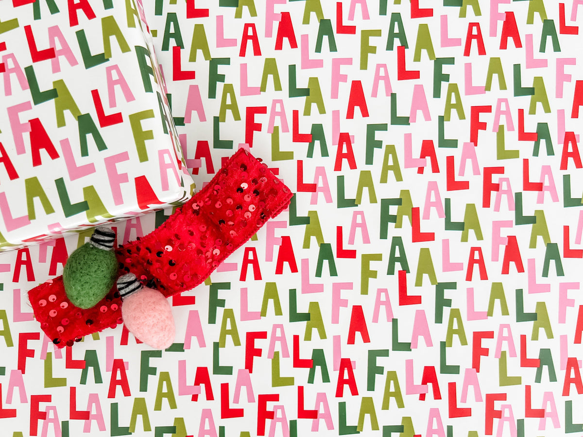 Wrapping paper with colorful Fa La La pattern