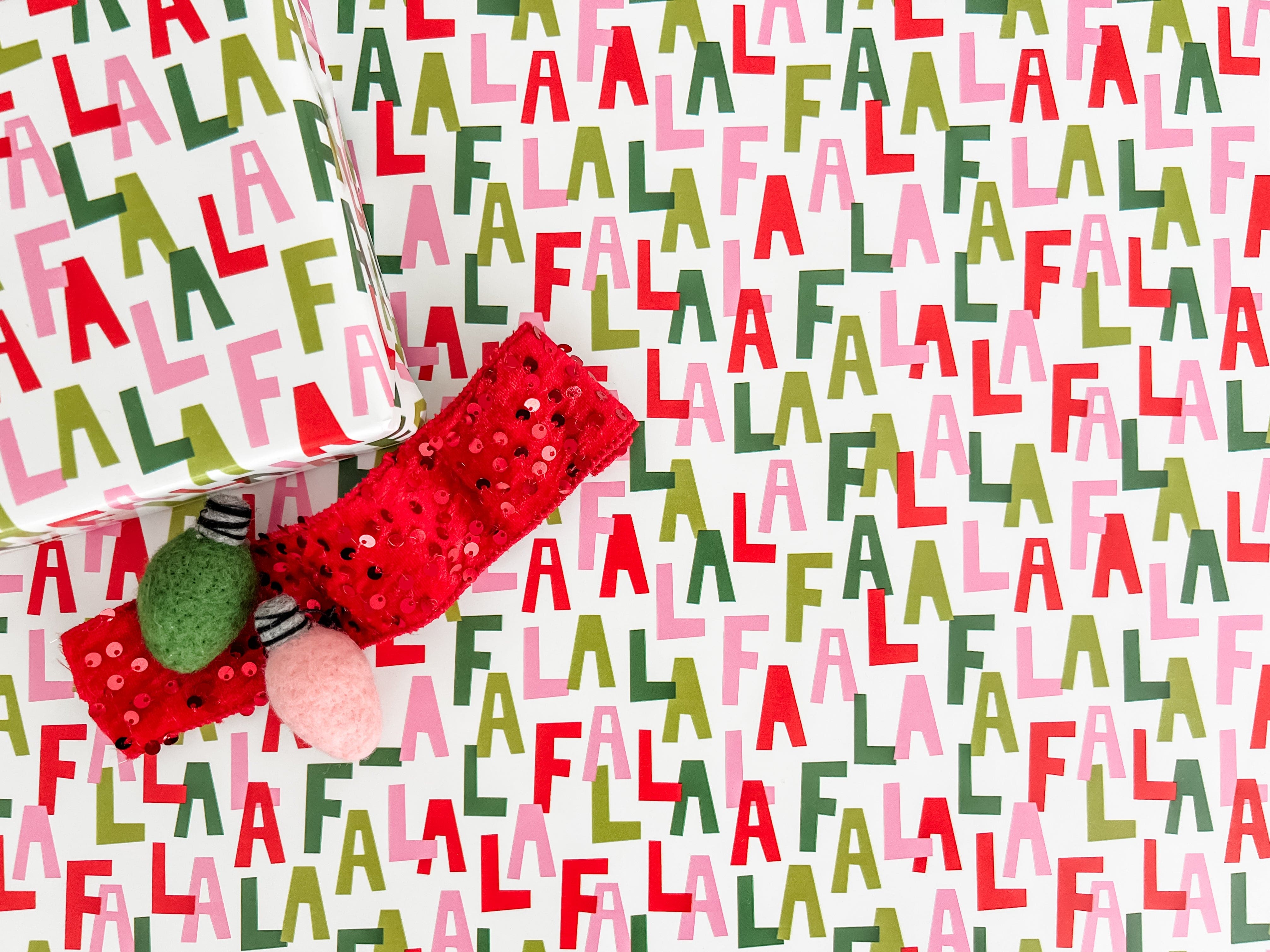 Wrapping paper with colorful Fa La La pattern