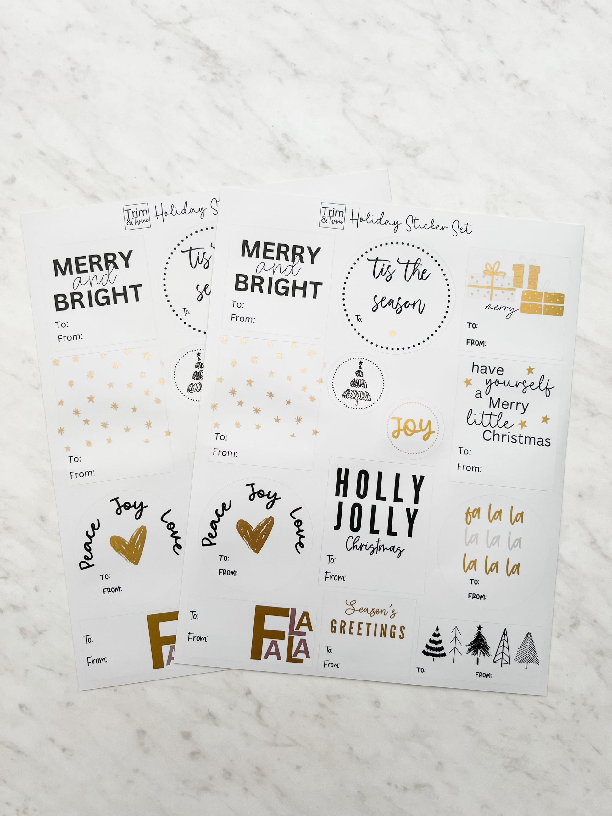 Two sheets of sticker labels with holiday themed designs, including phrases like 'Merry Bright' and 'Holly Jolly', with metallic gold accents.