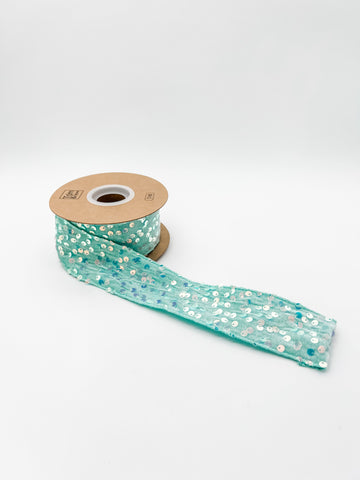 Blue ribbon with glitter on a white background
