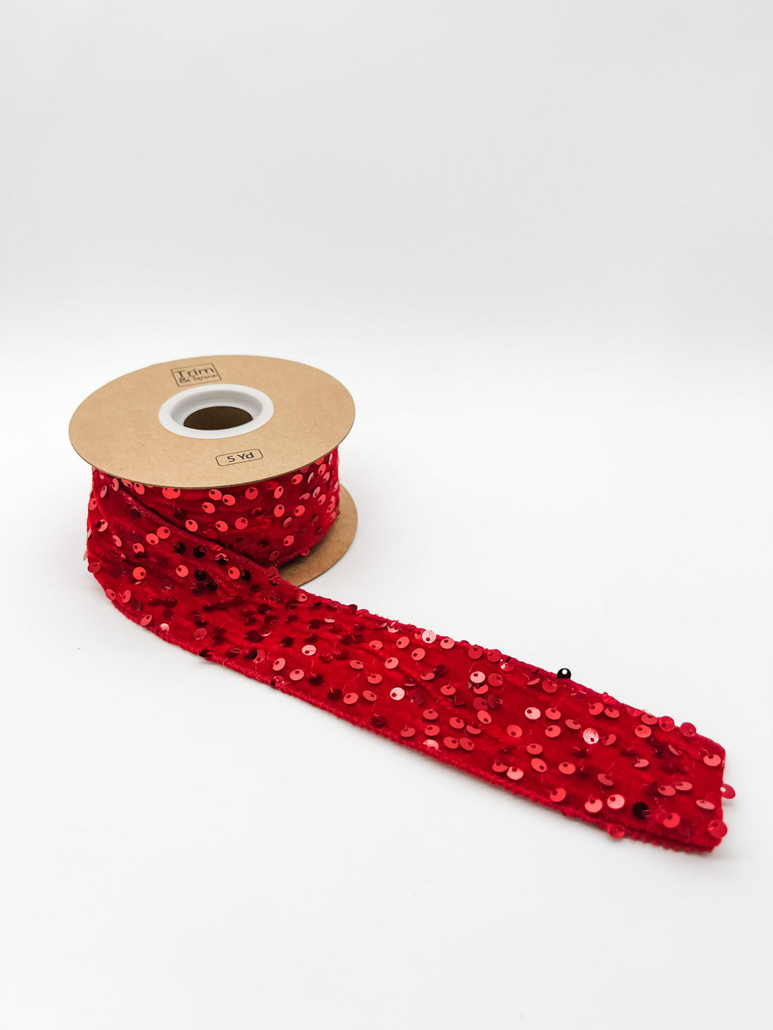 Red sequin velvet ribbon on a white background