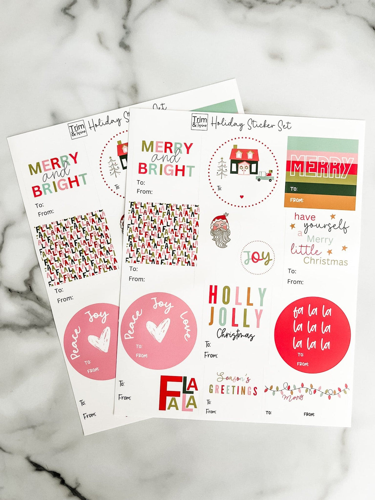 Set of Christmas-themed stickers on a marble surface