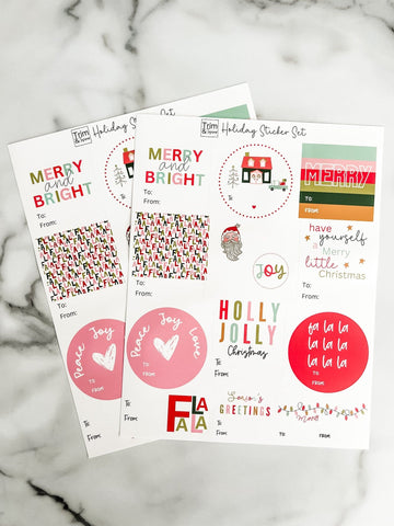 Set of Christmas-themed stickers on a marble surface