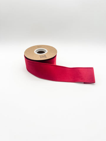 Red velvet ribbon on a white background