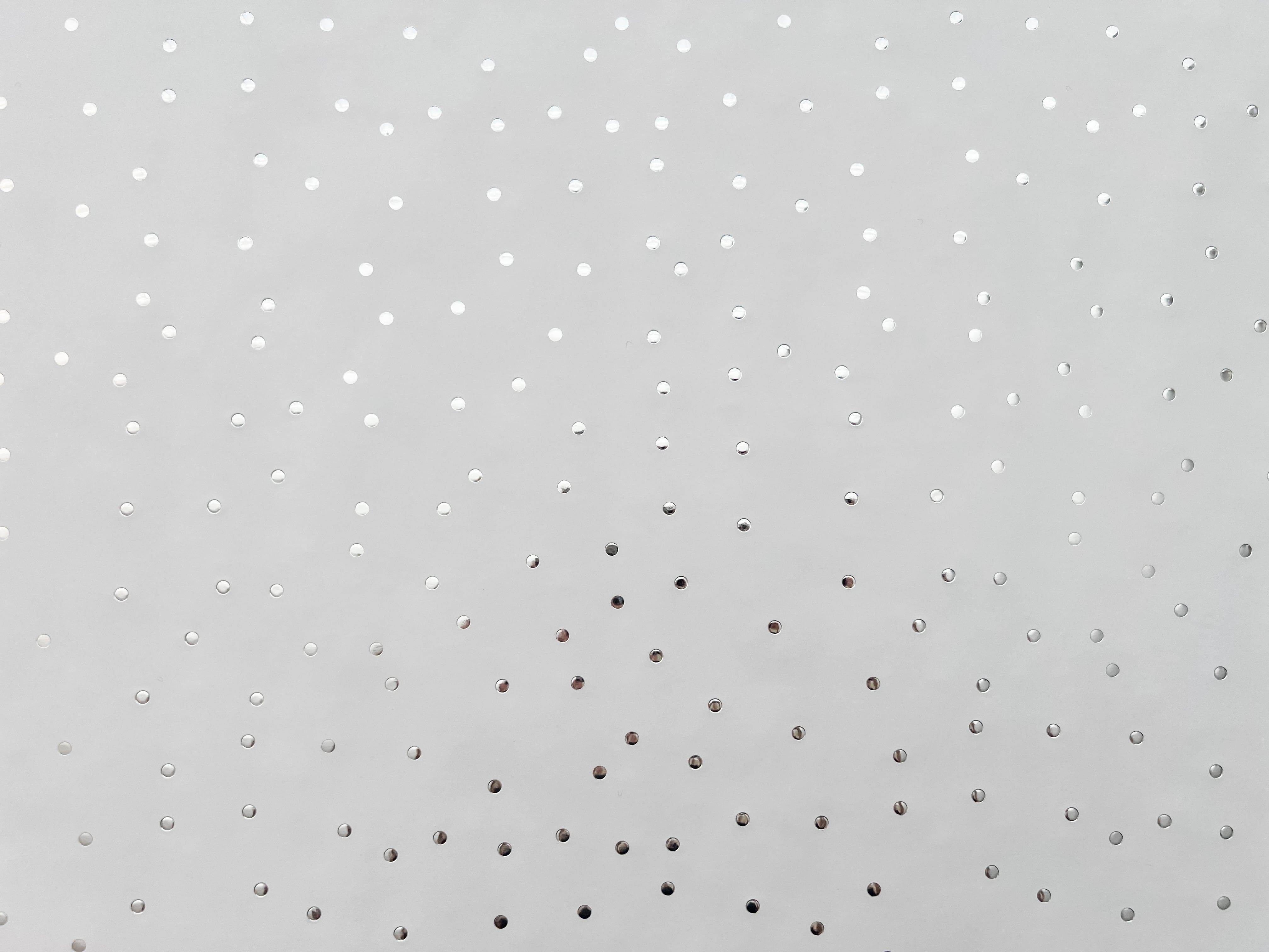 Silver metallic dot paper laid out flat