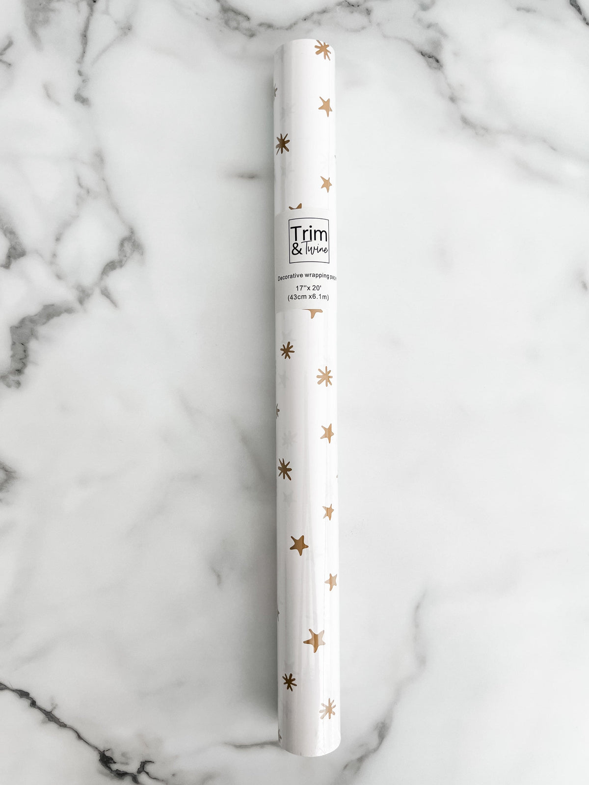Roll of gold star wrapping paper