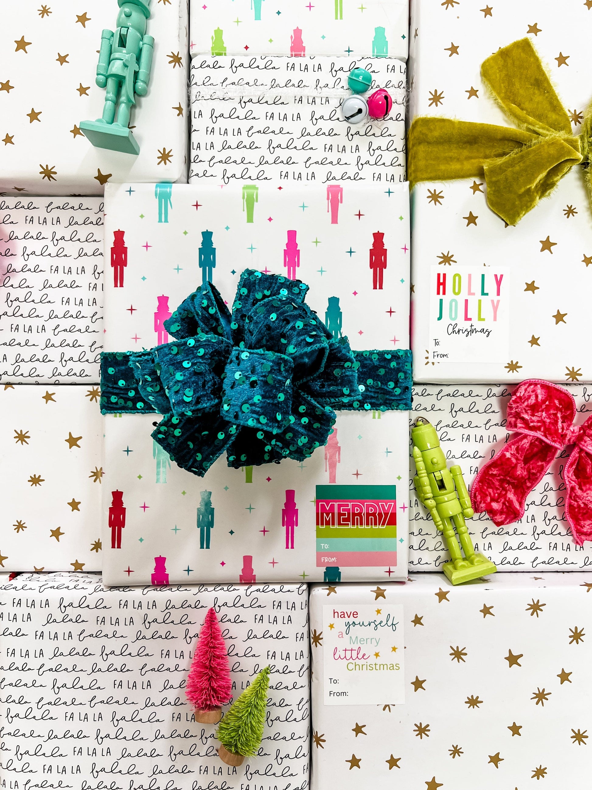 Collection of Christmas-themed gift wrap with decorative bows and ribbons.