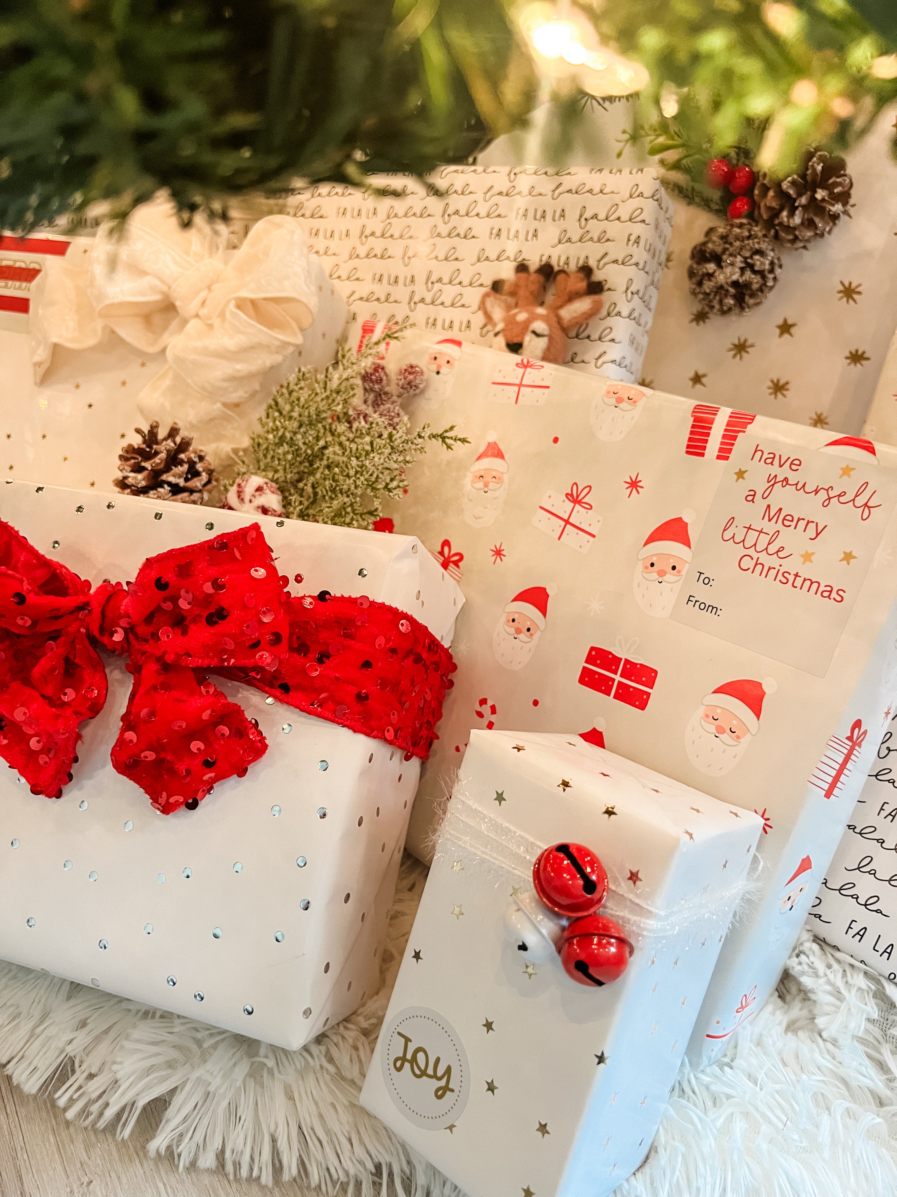 Christmas presents wrapped in festive paper with decorative ribbons and designs.
