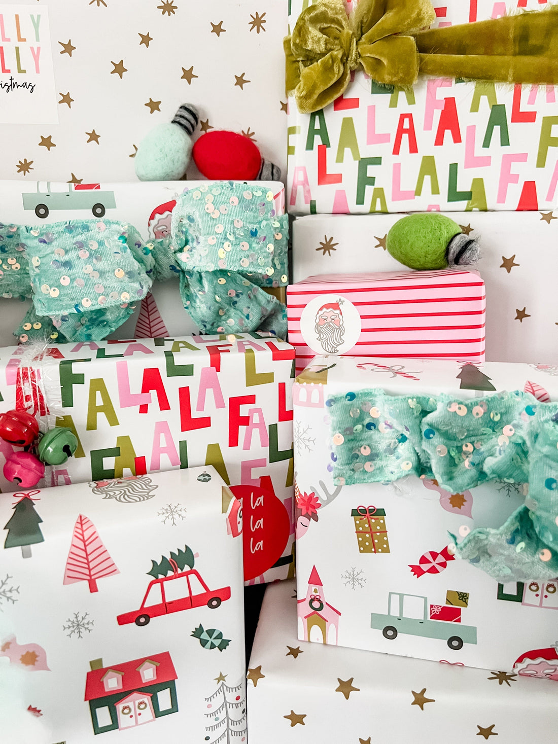 Christmas-themed wrapping paper with reindeer, Santa Claus, and trees on a white background.